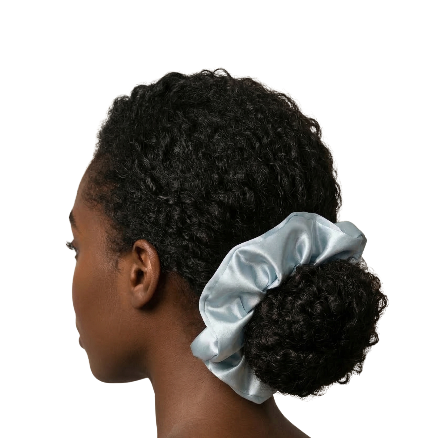 Woman with a blue satin hair scrunchie in her curly hair on a white background