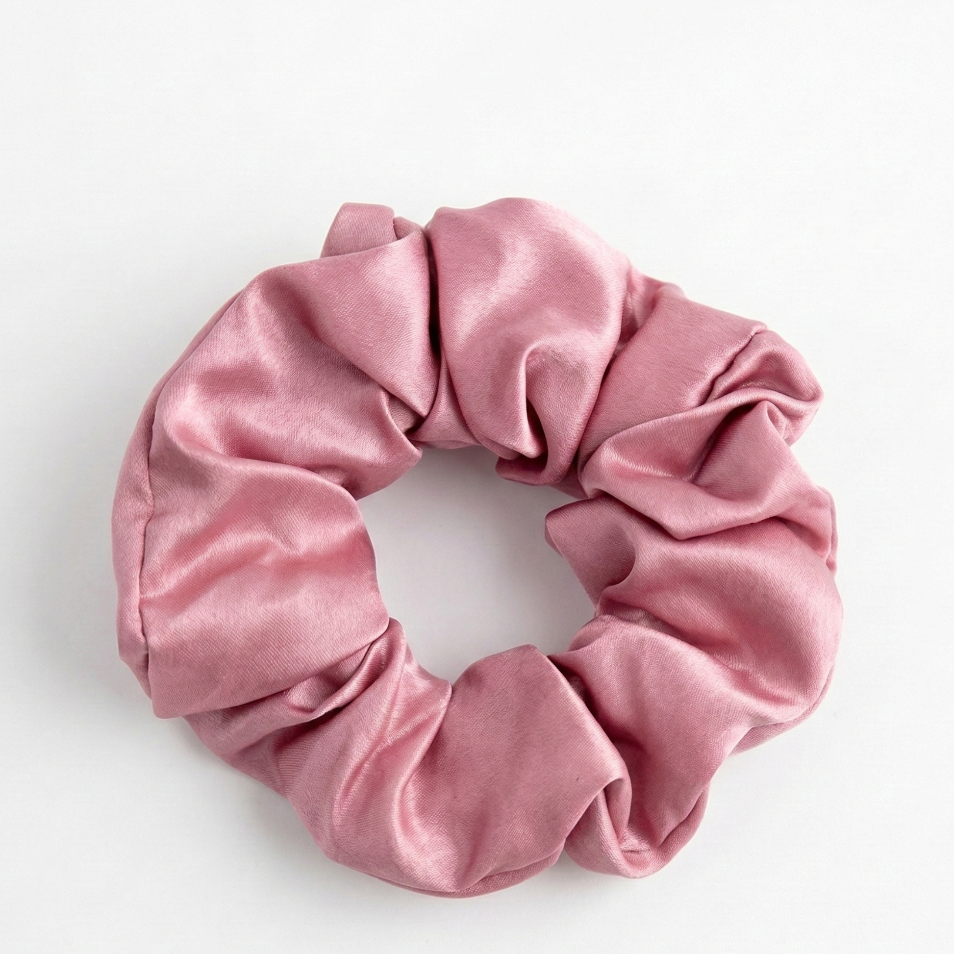 Pink scrunchie on a white background