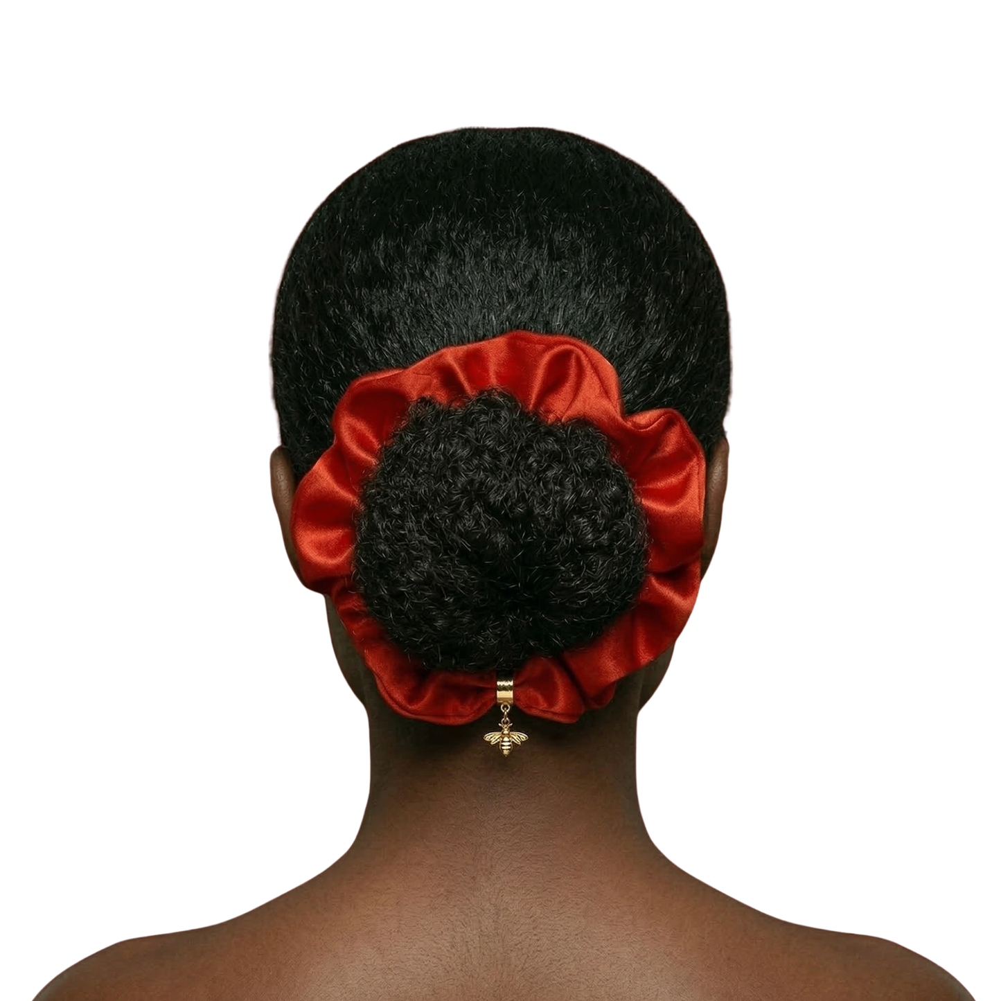 Red satin hair scrunchie on a person's hair against a white background