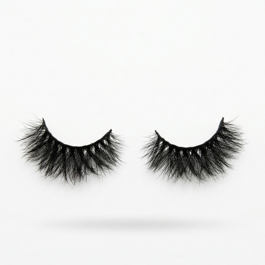 Pair of black false eyelashes on a white background