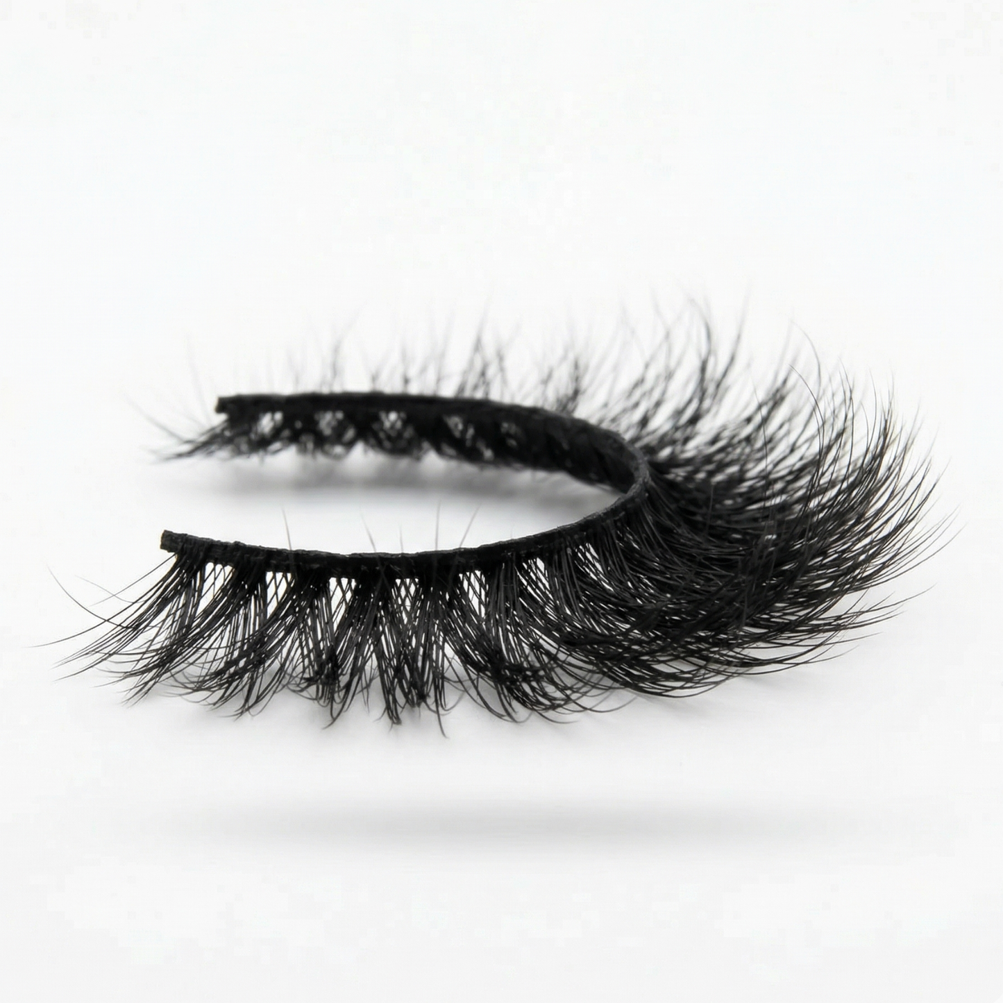 Pair of false eyelashes on a white background