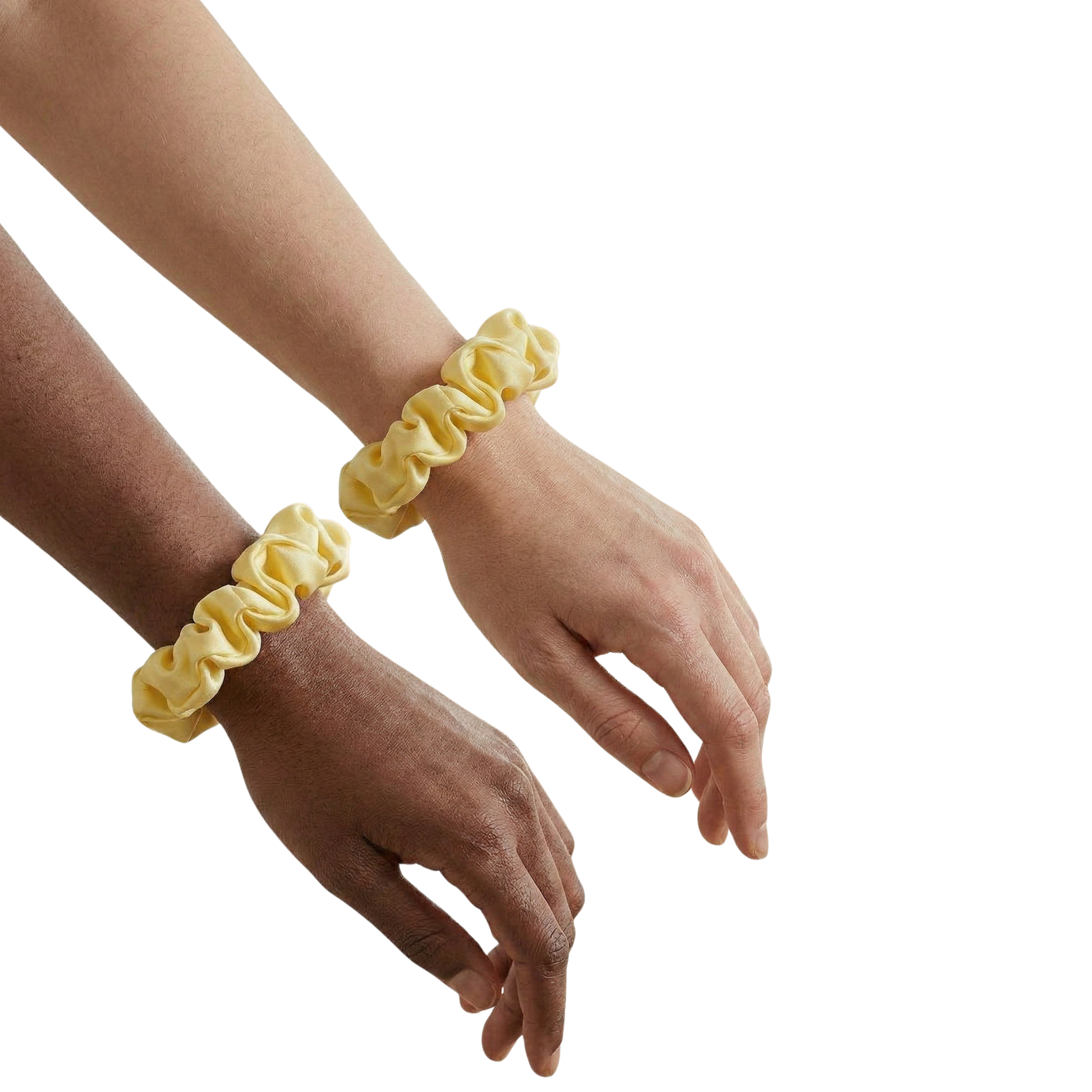 Two hands wearing yellow scrunchies on a white background