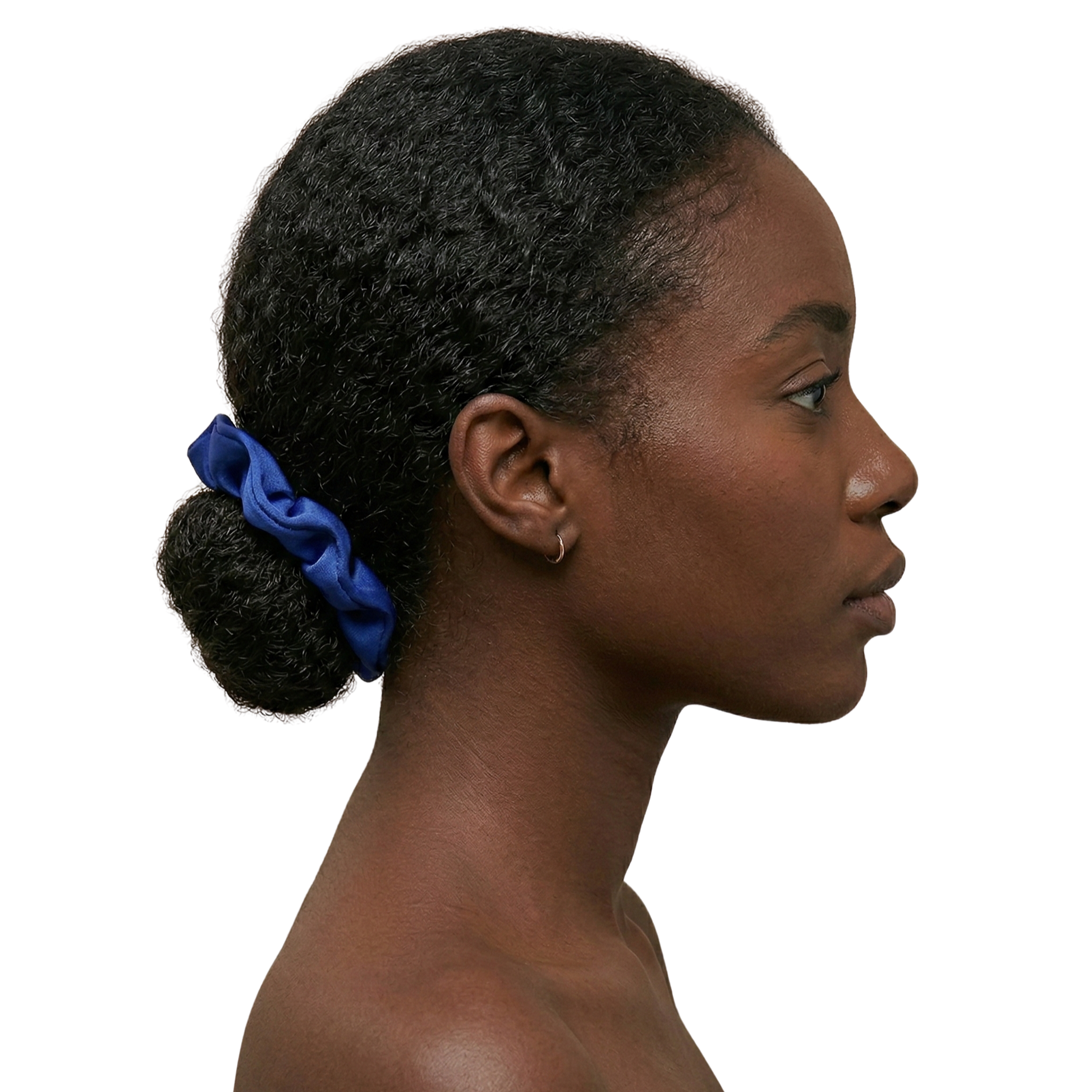 Woman with a blue scrunchie in her hair on a white background