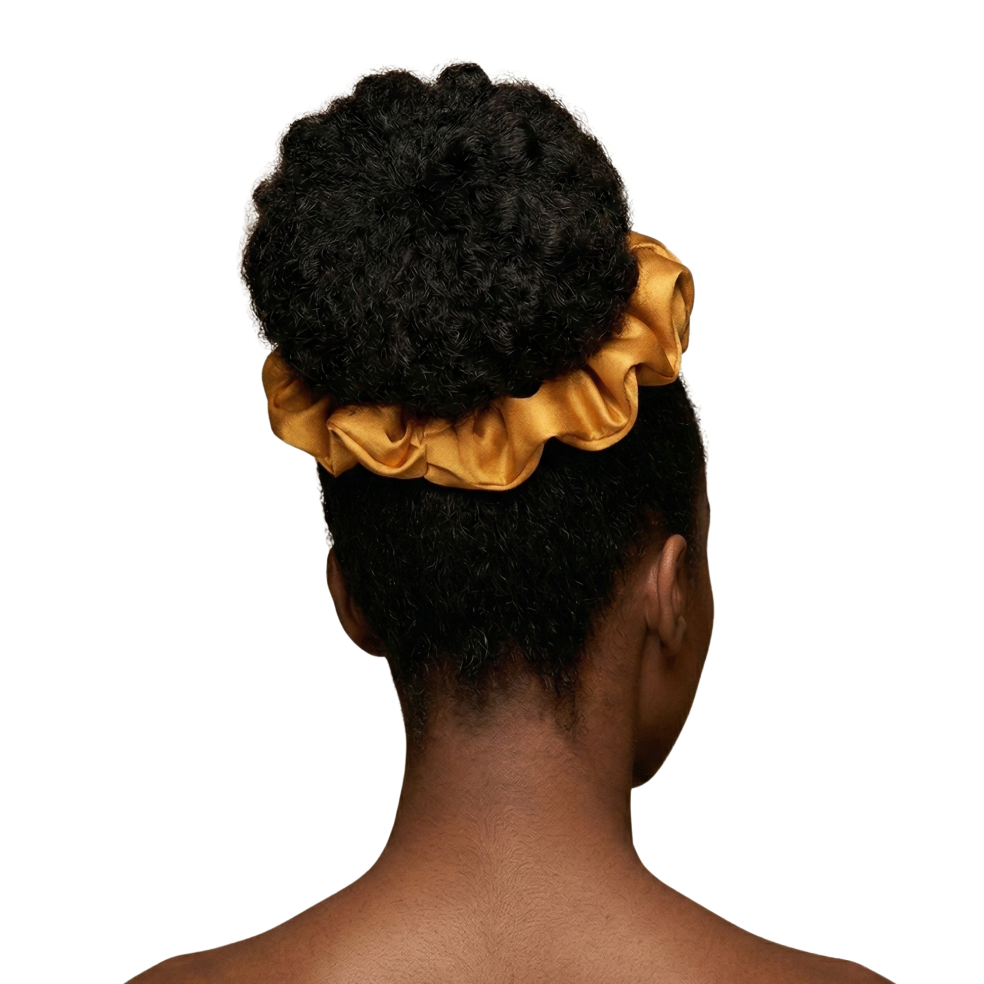 Person with a large bun wearing a gold satin scrunchie on a white background