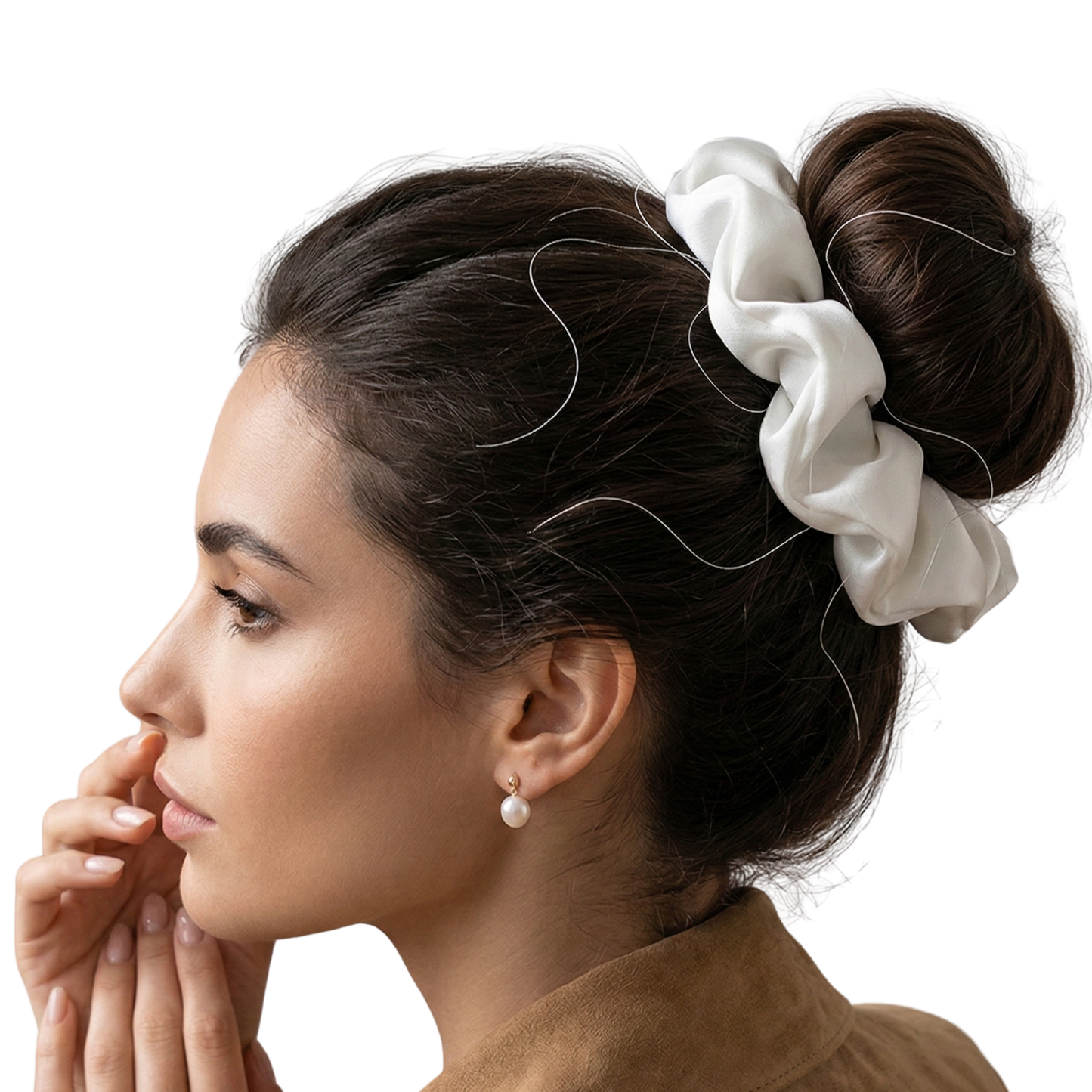 Woman with a white scrunchie in her hair on a white background