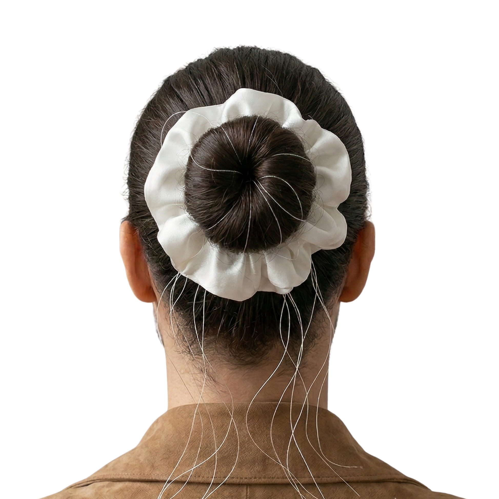 Person with a white hair scrunchie on a bun against a white background