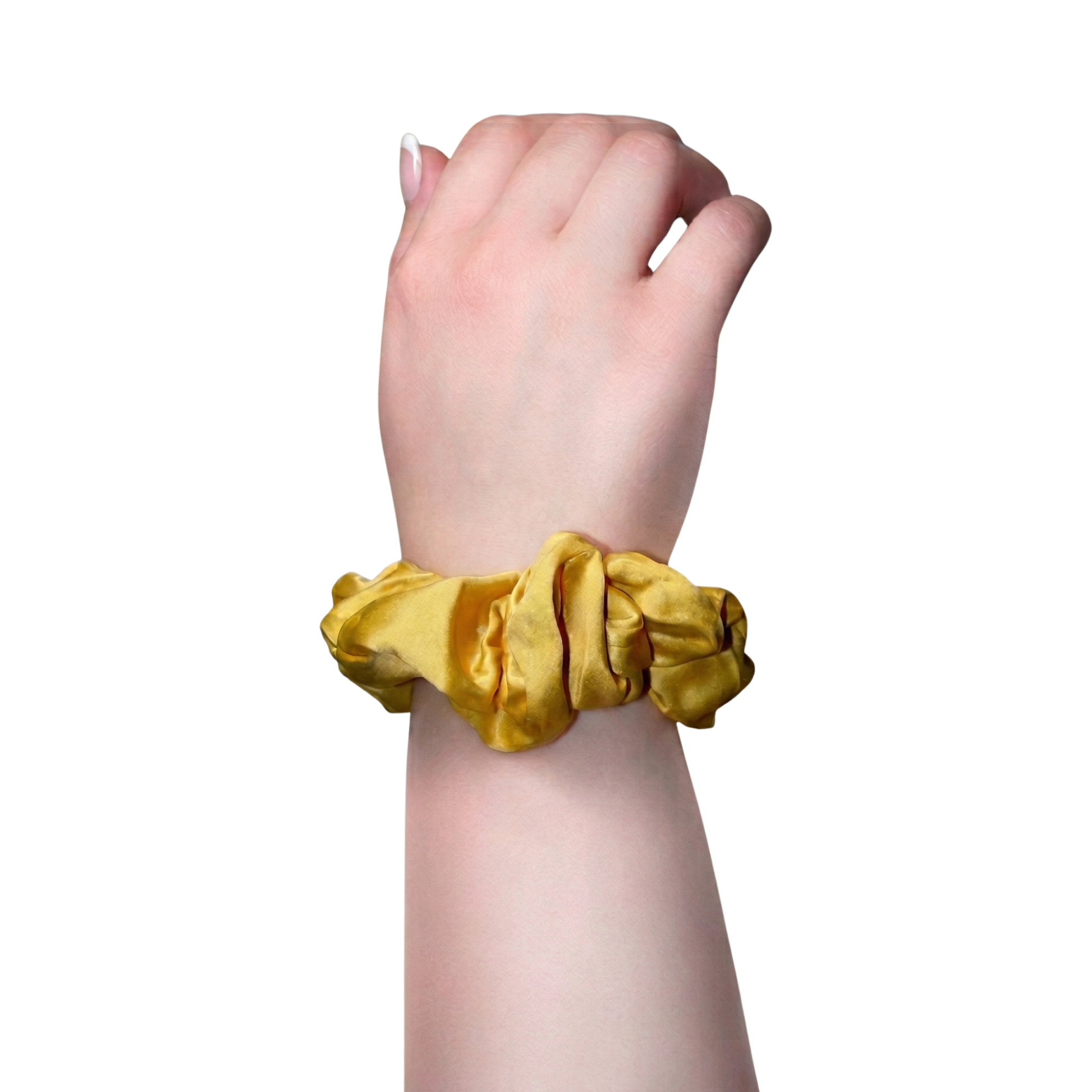 Yellow scrunchie on a wrist against a white background
