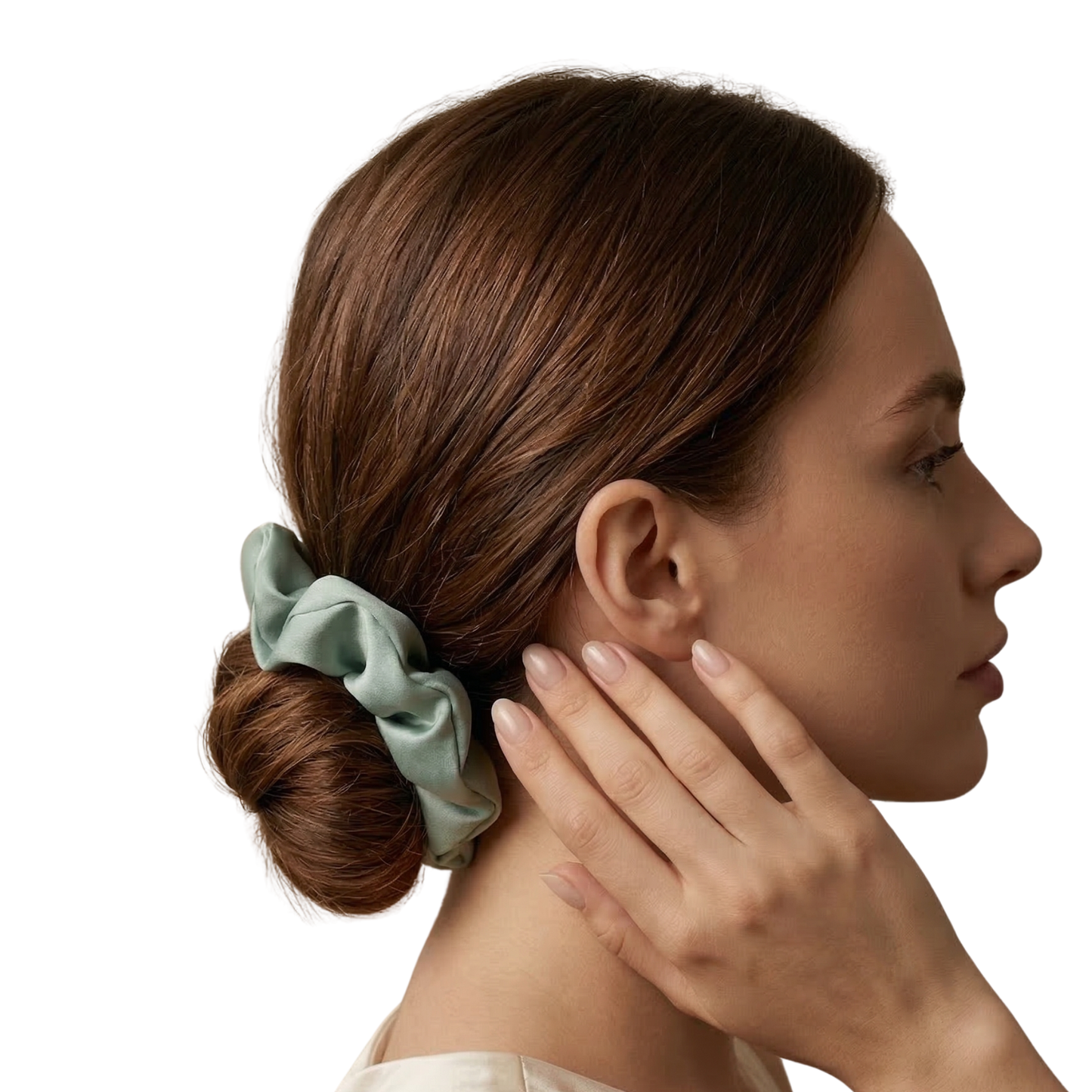 Woman with a green scrunchie in her hair on a white background