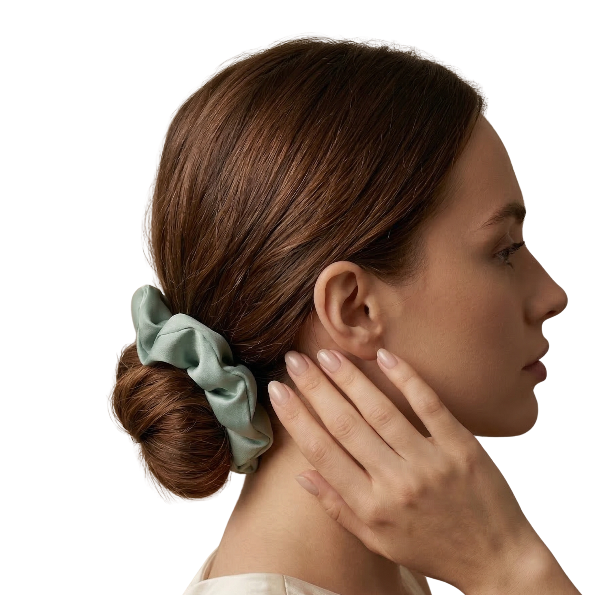 Woman with a green scrunchie in her hair on a white background
